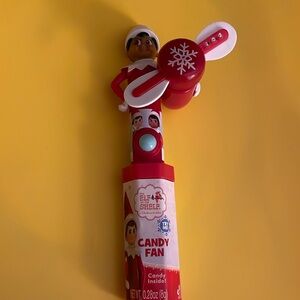 Elf on the Shelf light up spinner toy with candy.